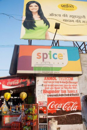 Photo for Street scene, hoardings of Coca Cola Spice telecom, Amritsar, Punjab, India - Royalty Free Image