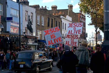Photo for Jesus IS Alive poster in Camden town market ; London ; U.K. United Kingdom England - Royalty Free Image