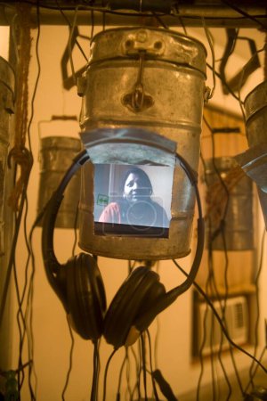 Photo for Movie playing inside Installed Lunch box ; Ghost Transmemoir ; exhibition by Contemporary Indian Art Artist Bose Krishnamachari ; Bombay Mumbai ; Maharashtra ; India - Royalty Free Image