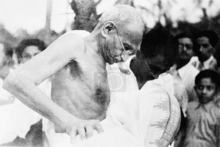 Photo for Mahatma Gandhi going for a walk at Mahabaleshwar, 1944, India - Royalty Free Image