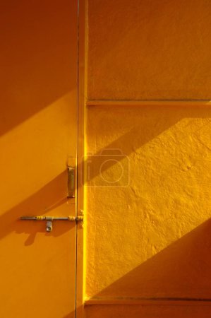 Photo for Door and textured wall ; Pune ; Maharashtra ; India 8-March-2009 - Royalty Free Image