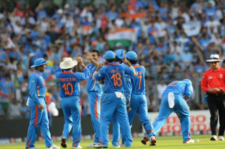 Photo for Indian bowler 3L Zaheer Khan celebrates with team after taking the wicket of Chamara Kapugedera of Sri Lanka Not in picture during the 2011 ICC World Cup Final between India and Sri Lanka at Wankhede Stadium on April 2 2011 in Mumbai India - Royalty Free Image