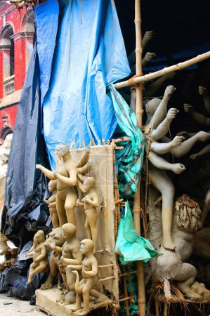 Photo for Incomplete idol of goddess durga kept for drying ; Kumartuli ; Calcutta Kolkata ; West Bengal ; India 30-August-2009 - Royalty Free Image