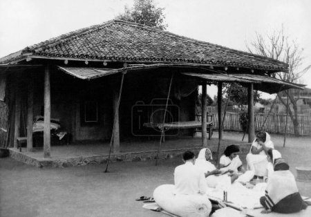 Photo for Mahatma Gandhi at work at Sevagram Ashram, Vardha, Maharashtra, India, September 1939 - Royalty Free Image