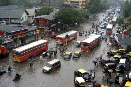 Photo for On the heavy rainfall day some parts of Bombay ; now Mumbai city takes shape of an island ; Similar situation is here on such a heavy rainfall day ; the Lal Bahadur Shastri Marg at Kurla in the central suburb of Bombay Mumbai city ; Maharashtra ; Ind - Royalty Free Image