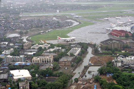 Photo for An aerial view of Mumbais Chhatrapati Shivaji Maharaj International airport also seen of runways aircrafts parked at the premises area around airport at sahar in the suburb of Bombay Mumbai ; Maharashtra ; India - Royalty Free Image