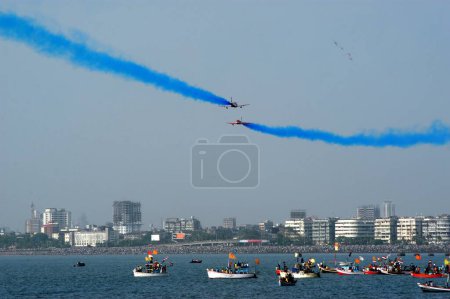 Photo for Indian Air force Surya Kiran performing in air during an air show organized by the Air Force at Marine Drive in Bombay now Mumbai ; Maharashtra ; India - Royalty Free Image