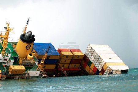 Photo for Container ship chitra tilted dangerously colliding in sea ; Bombay Mumbai ; Maharashtra ; India 9-August-2010 - Royalty Free Image