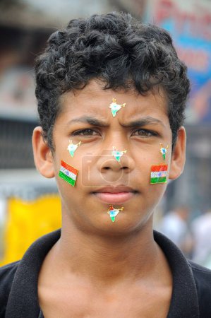 Photo for A boy painted his face with Indian flags, Jodhpur, Rajasthan, India - Royalty Free Image