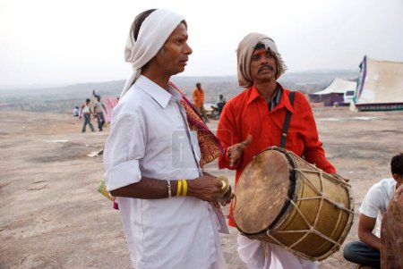 Photo for Men singing and playing musical instruments on mahashivaratri celebration at Keesaragutta, Hyderabad, Andhra Pradesh, India - Royalty Free Image