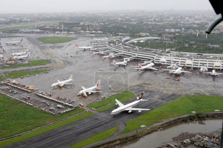 Photo for An aerial view of Air India aircrafts parked and runways at airport of Mumbais Chhatrapati Shivaji Maharaj International at Sahar ; Bombay Mumbai ; Maharashtra ; India - Royalty Free Image