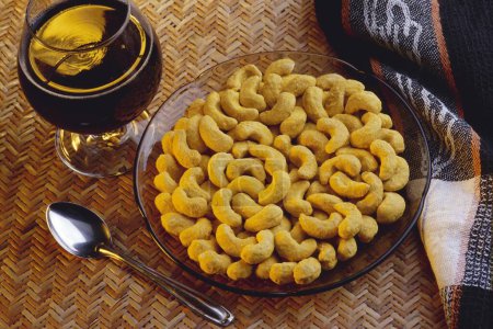 Dry fruit , butter scotch flavored Cashew nuts and glass of juice