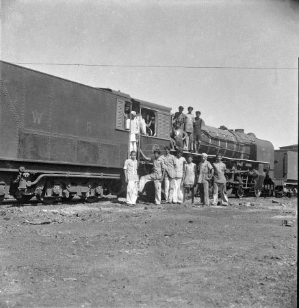 Photo for Old vintage 1900s black and white picture of Indian train steam engine India 1940s - Royalty Free Image