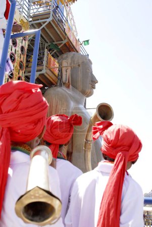Photo for Jain devotees participating and Praying of 58.8 feet monolithic Statue of jain saint Gomateshwara in Mahamastakabhisheka on the Vindhyagiri hill, Shravanbelagola, Karnataka, India - Royalty Free Image