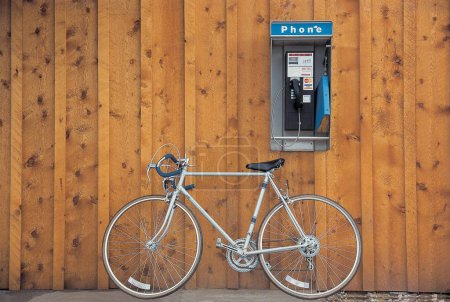Photo for Bicycle at telephone booth, Utah; U.S.A. United States of America - Royalty Free Image