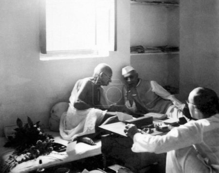 Photo for Mahatma Gandhi talking with Jawaharlal Nehru at Bhangi Colony in Delhi, October 2, 1946, India - Royalty Free Image