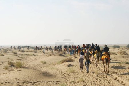 Photo for Camel ride at Sam Thar desert safari sand dunes , Jaisalmer , Rajasthan , India - Royalty Free Image