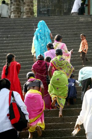 Photo for Devotees climbing stairs to famous Jejuri temple, Pune, Phaltan, Maharashtra, India - Royalty Free Image