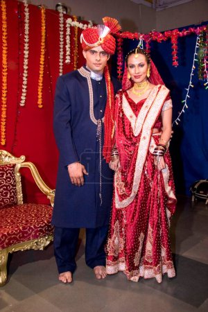 Photo for Indian bride and bridegroom in traditional wearing for marriage ceremony - Royalty Free Image