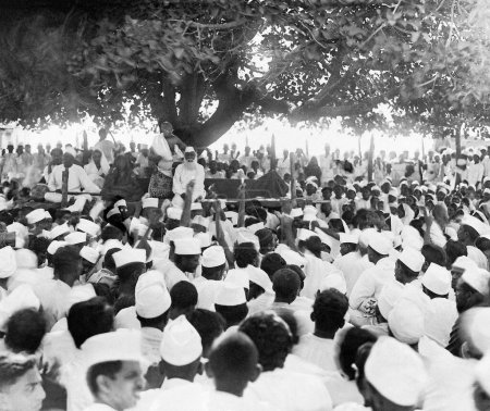 Photo for Mahatma Gandhi addressing a public meeting at Dandi, Gujarat, India on the evening of April 5, 1930 - Royalty Free Image