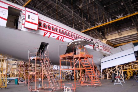Photo for Maintenance work of Air India plane at Sahar airport Chatrapati Shivaji International airport in Bombay Mumbai, Maharashtra, India - Royalty Free Image