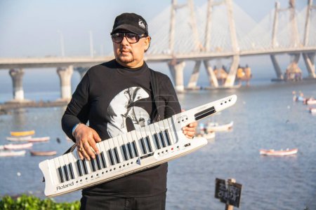 Photo for Louis Banks playing synthesizer worli mumbai maharashtra India Asia - Royalty Free Image