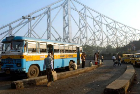 Photo for Howrah Bridge (Rabindra Setu)  A miracle of engineering skill  ; Huge cantilever and wide bridge ; Kolkata ; West Bengal ; India - Royalty Free Image
