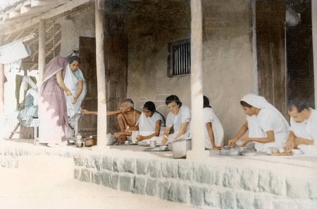 Photo for Mahatma Gandhi and others taking dinner Sevagram Ashram, Wardha, India, Asia, November 1933 - Royalty Free Image