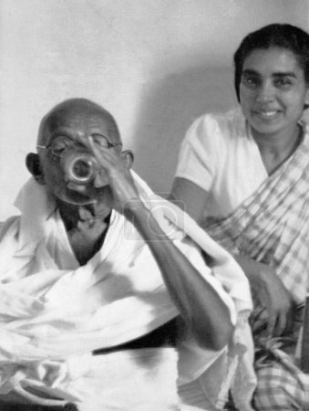 Photo for Mahatma Gandhi breaking his last fast in Birla House, New Delhi, India, January 18, 1948 - Royalty Free Image