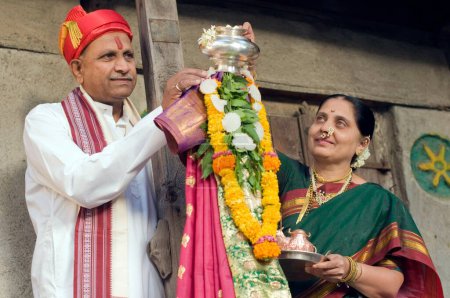 Photo for Maharashtrian couple performing the festival of Gudi Padva Pune India Asia MR#686CC - Royalty Free Image