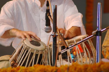 Photo for Music , Indian Classical Music , Musical Instrument , Drum , Tabla , Artist Ustad Zakir Hussain , Rhythm , Performing , Fingers playing - Royalty Free Image