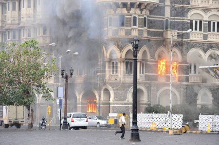 Photo for Fire inside the Taj Mahal hotel ; after terrorist attack by Deccan Mujahideen on 26th November 2008 in Bombay Mumbai ; Maharashtra ; India - Royalty Free Image