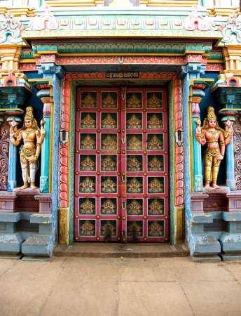 Photo for Richly decorated and painted wooden door of ranganathaswamy temple at srirangam near Tiruchirappalli , Tamil Nadu , India - Royalty Free Image