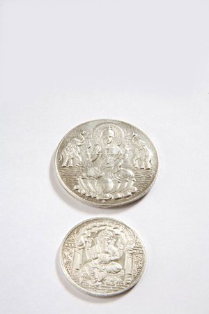 Photo for Concept , silver coins of god ganesh and goddess lakshmi on white background - Royalty Free Image
