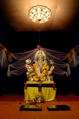 Photo for Idol of Lord Ganesh with simple decoration ; worshiping for Ganapati festival ; elephant headed god of Hindu ; Pune ; Maharashtra ; India - Royalty Free Image