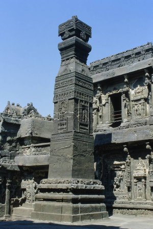 Carved Dhwaja Stambha outside Kailasa temple, Ellora, Aurangabad, Maharashtra, India, Asia
