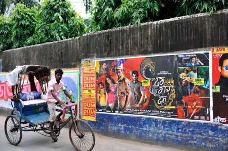 Photo for Election poster of candidates at Kolkata India competing with cycle rickshaws Film posters - Royalty Free Image