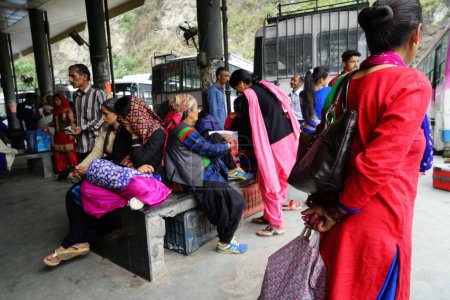 Photo for Himachali women waiting at bus stop, Banjar town, Tirthan Valley, Kullu, Himachal Pradesh, India, Asia - Royalty Free Image