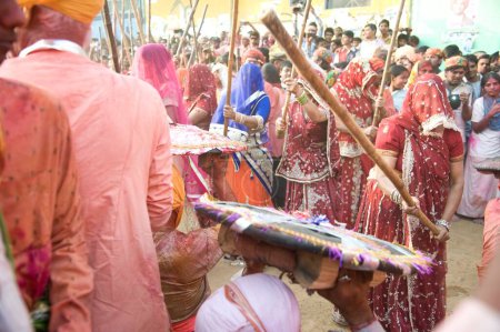Photo for People celebrating lathmar, holi festival, mathura, uttar pradesh, india, asia - Royalty Free Image