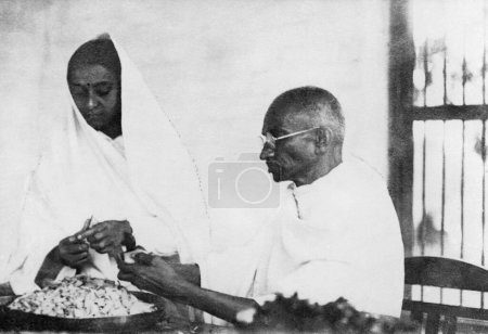 Photo for Mahatma Gandhi and a woman cutting vegetables , 1946 - Royalty Free Image