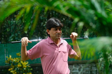 Photo for Billiards and Snooker champion Geet Sriram Sethi play game of golf at BPGC Bombay Presidency Golf Club in Bombay Mumbai, Maharashtra, India - Royalty Free Image