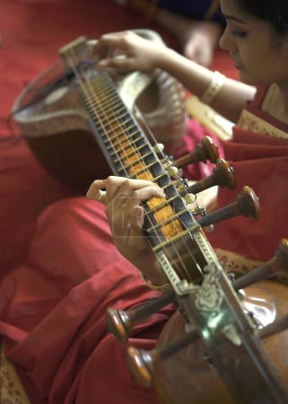 Photo for Lady playing veena south Indian musical instrument in religious ceremony - Royalty Free Image