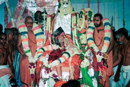 Photo for Jayendra Saraswati Swamigal and Chandrasekharendra Saraswati Swamigal with Sankara Vijayandra Saraswati Swamigal during Swarnabhisekham function in Kanchipuram, Tamil Nadu, India 1994 - Royalty Free Image