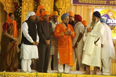 Photo for Prime minister Dr Manmohan Singh with cabinet colleague Shivraj Patil, Ashok Chavan and Vilasrao Deshmukh at occasion of Guru Granth Sahib, Nanded, Maharashtra, India 30 October 2008 - Royalty Free Image