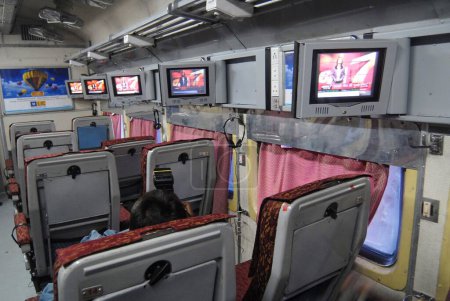Photo for Indian Railways introduce television sets on experimental basis in one of air conditioned bogie at Mumbai Central railway station in Bombay Mumbai ; Maharashtra ; India - Royalty Free Image