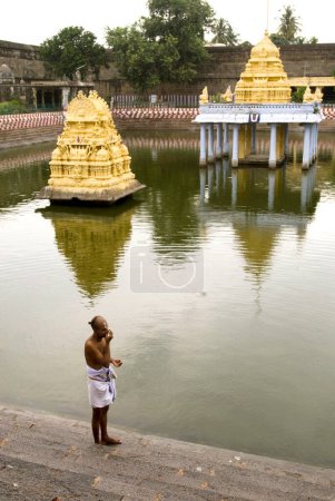 Photo for Priest performing daily rituals at Varadaraja Perumal temple in Kanchipuram, Tamil Nadu, India - Royalty Free Image
