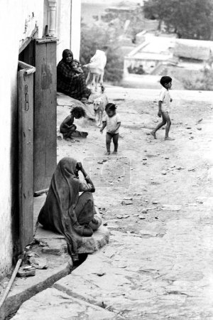 Photo for Indian woman sitting in village street Barsana Vrindavan Uttar Pradesh India Asia 1971 - Royalty Free Image