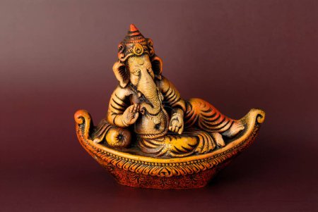 Idol of Ganesha (elephant headed god) in a boat made in terracotta craft ; Delhi  ;India ; Asia