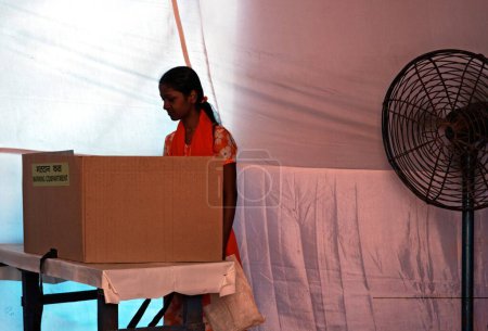 Photo for Voter casting her vote in elections, Bombay Mumbai, Maharashtra, India   30, April, 2009 - Royalty Free Image