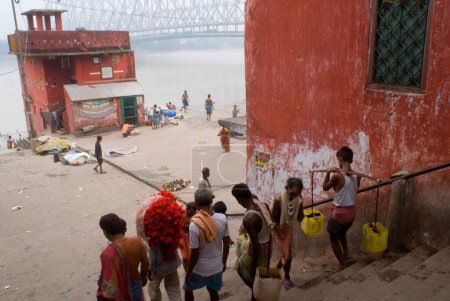 Photo for Howrah Bridge (Rabindra Setu)  A miracle of engineering skill  ; Huge cantilever and wide bridge ; Kolkata ; West Bengal ; India - Royalty Free Image
